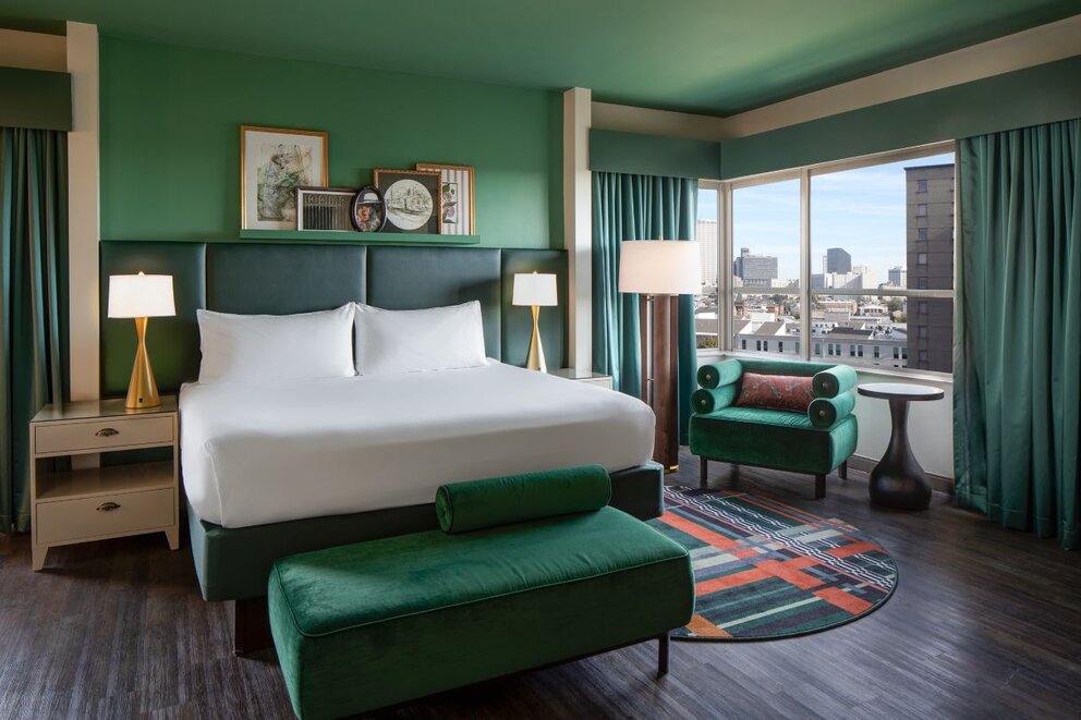 wide view of the mayflower suite facing bed