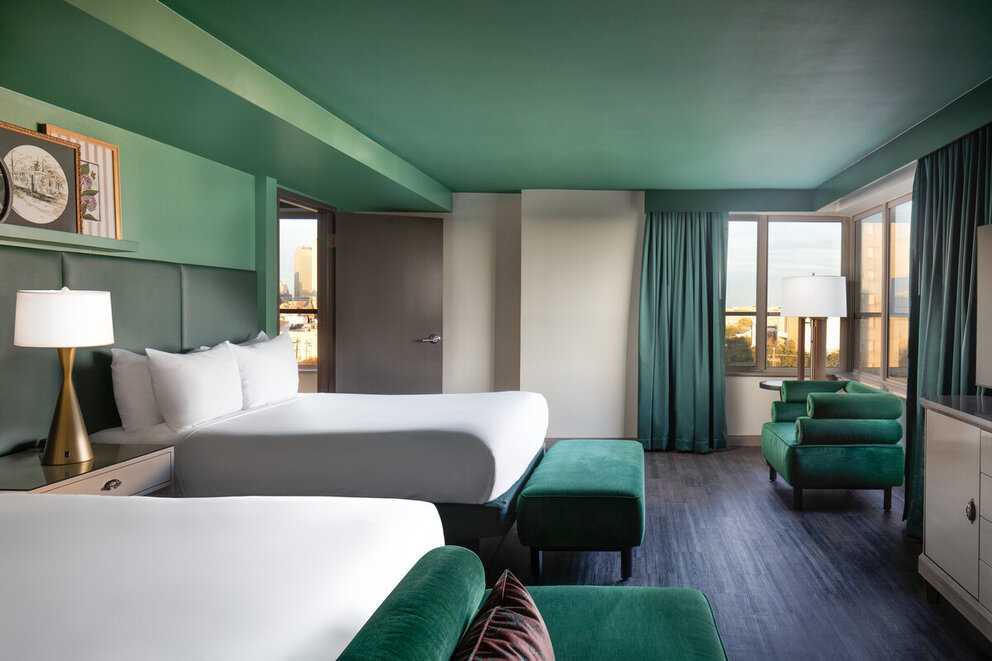 wide view of the junior suite with two queen beds