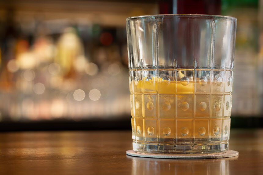 a glass with a drink in it