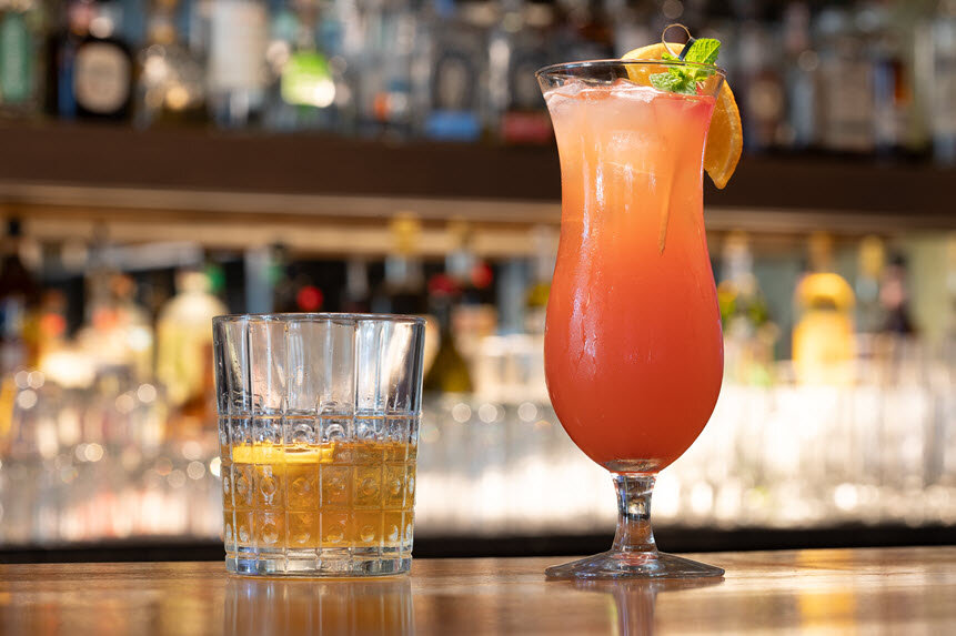 a glass of liquid next to a glass of liquid