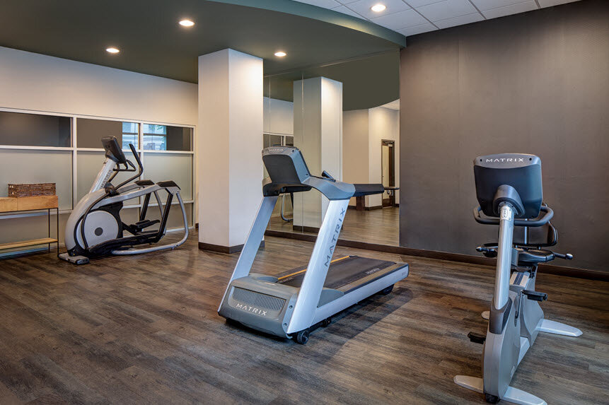 a room with treadmills and exercise machines