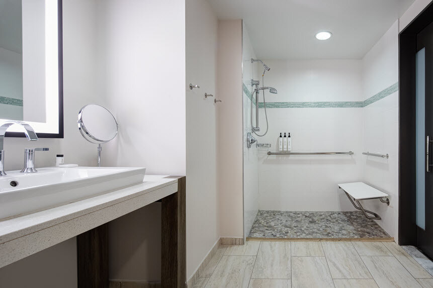 a bathroom with a sink and shower