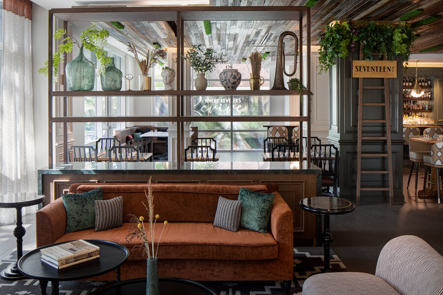 a room with a couch and a glass wall