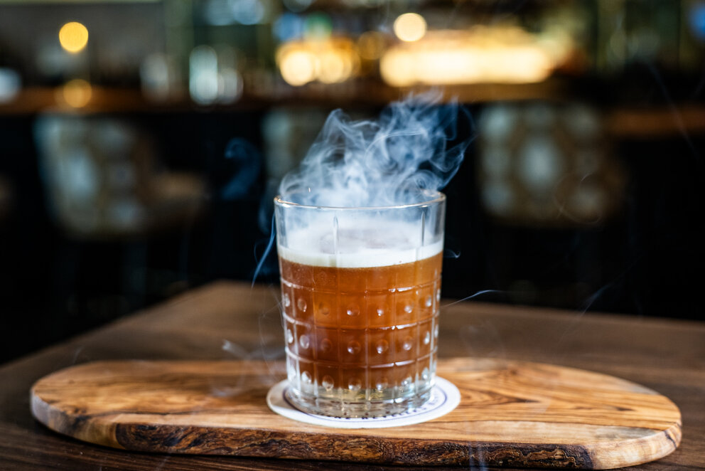 a glass with a drink in it