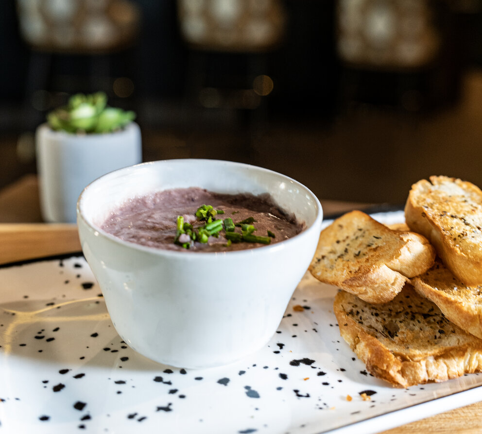 a plate of food with a bowl of soup and toast